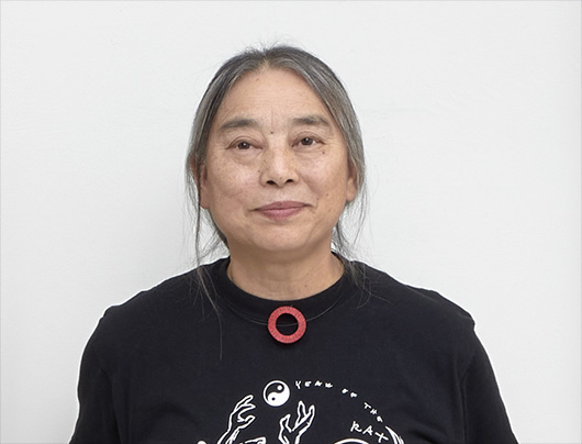 Detail photo of an Asian woman in a black shirt