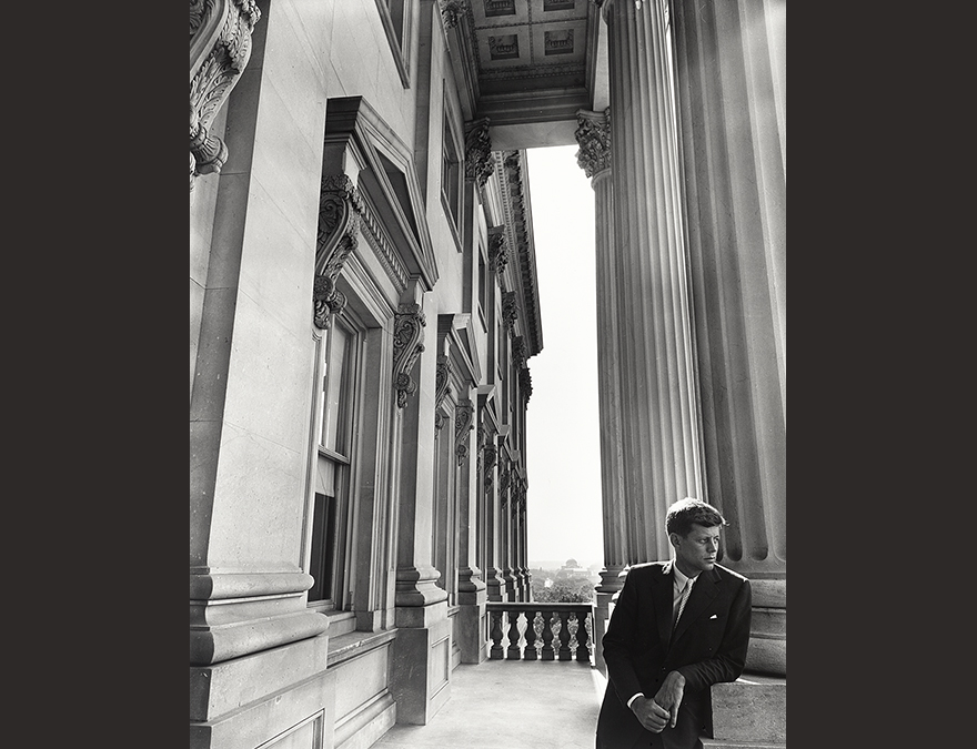 Man leaning against a column at the US Capitol