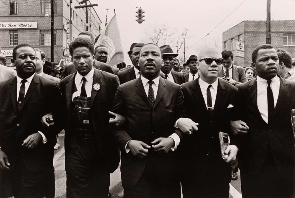 Group of African American men marching in protest