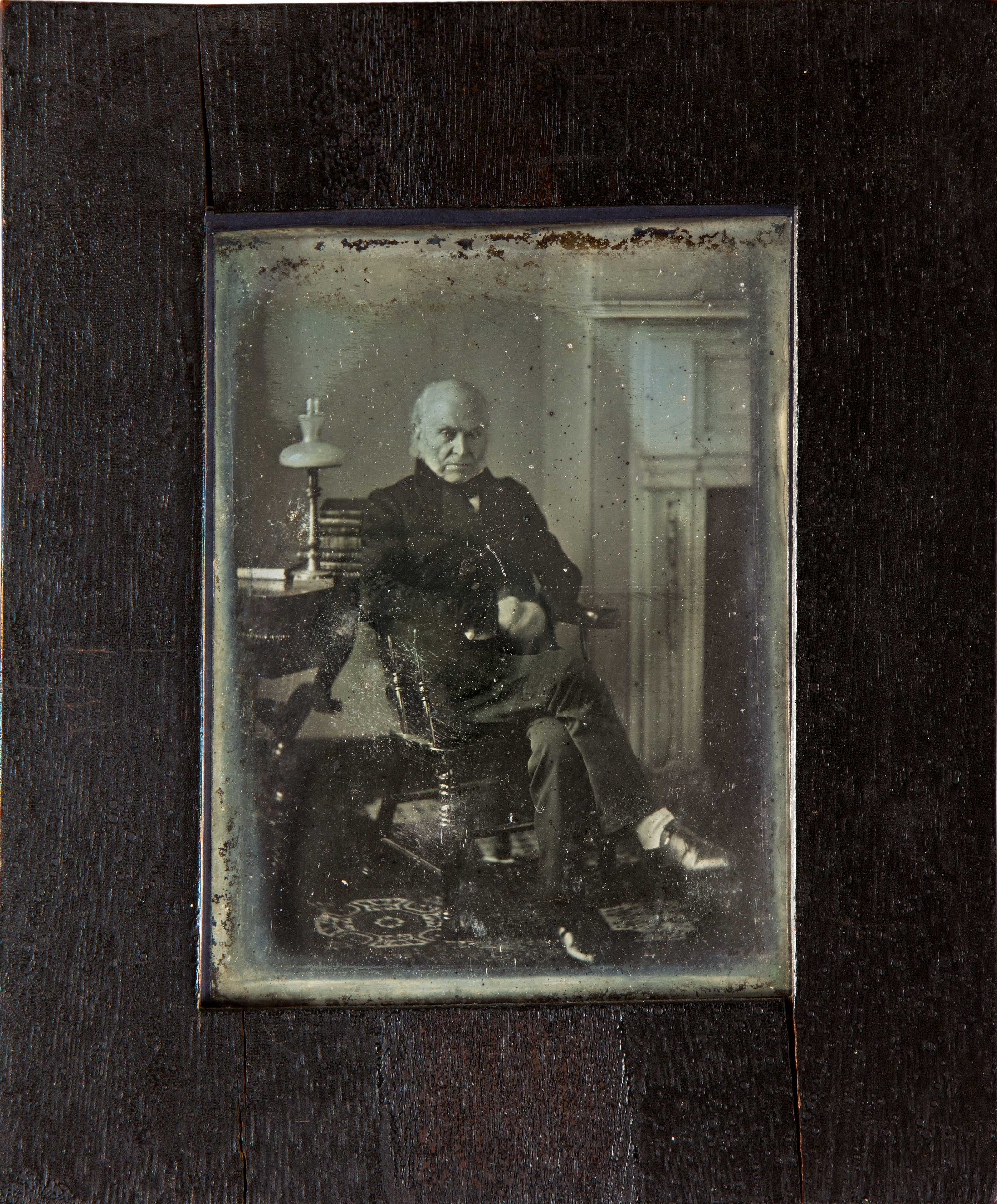 Very old photograph of an old man looking at the camera