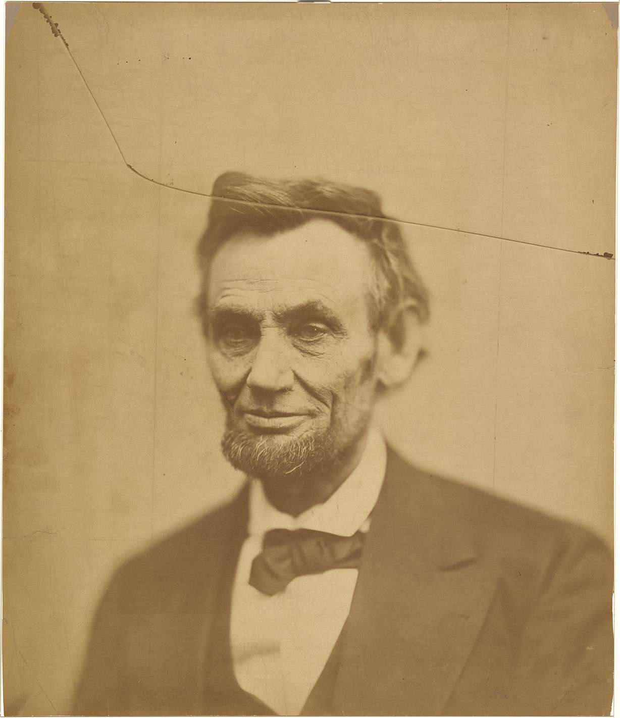 Photograph portrait of Abraham Lincoln, with crack going through upper portion