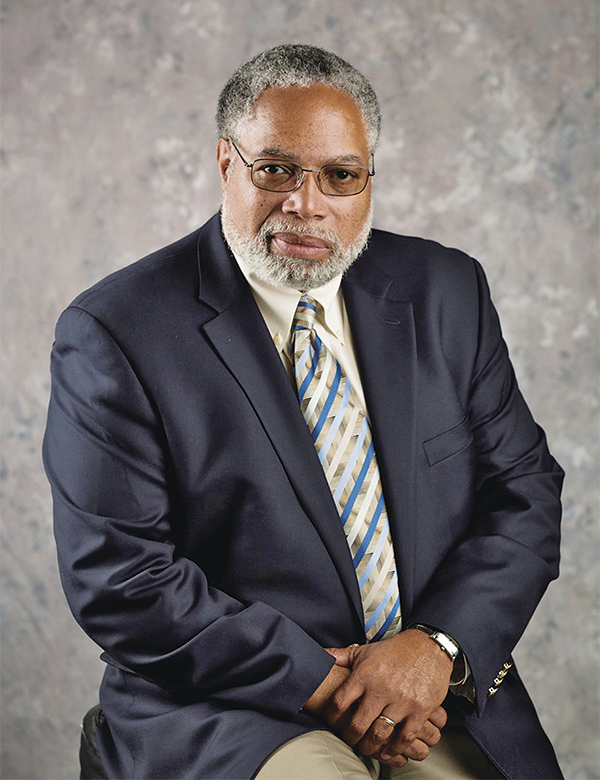 African American man with a beard in suit and tie