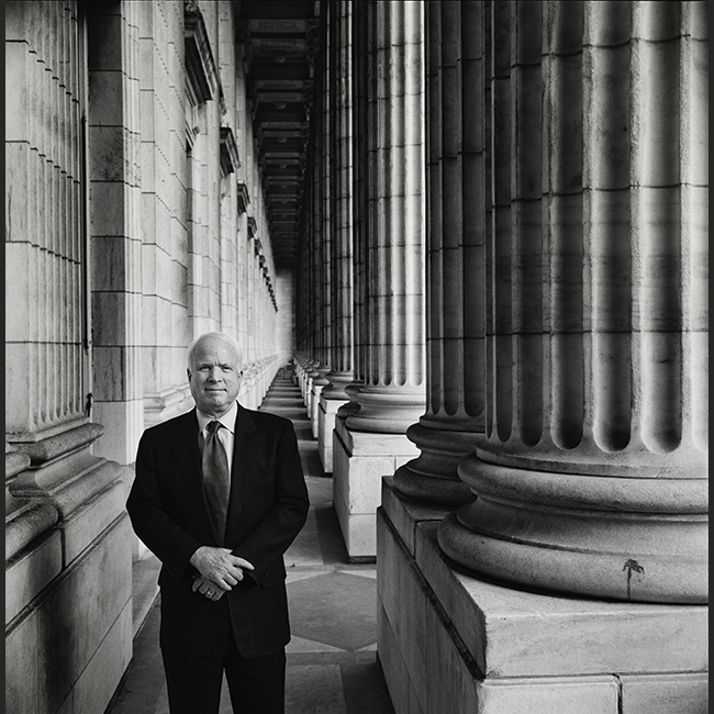 Man standing in front of Capito columns