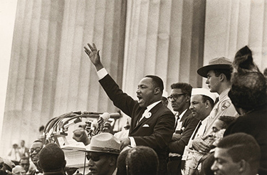 black and white photo of a man speaking at the Lincoln Memorial