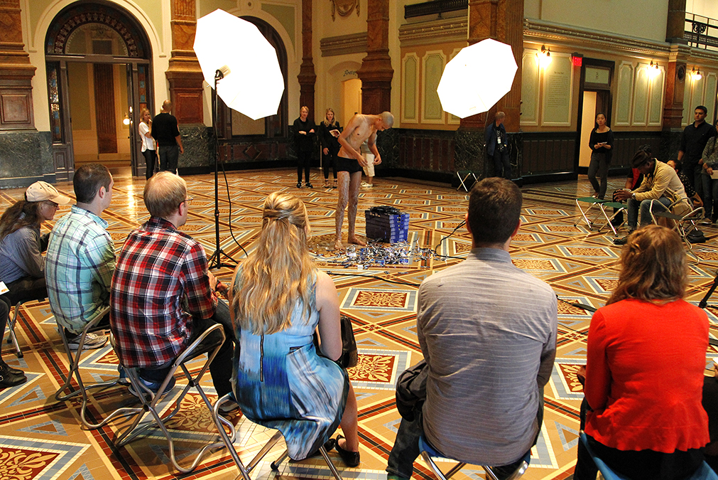 Visitors in the Great Hall viewing the performance