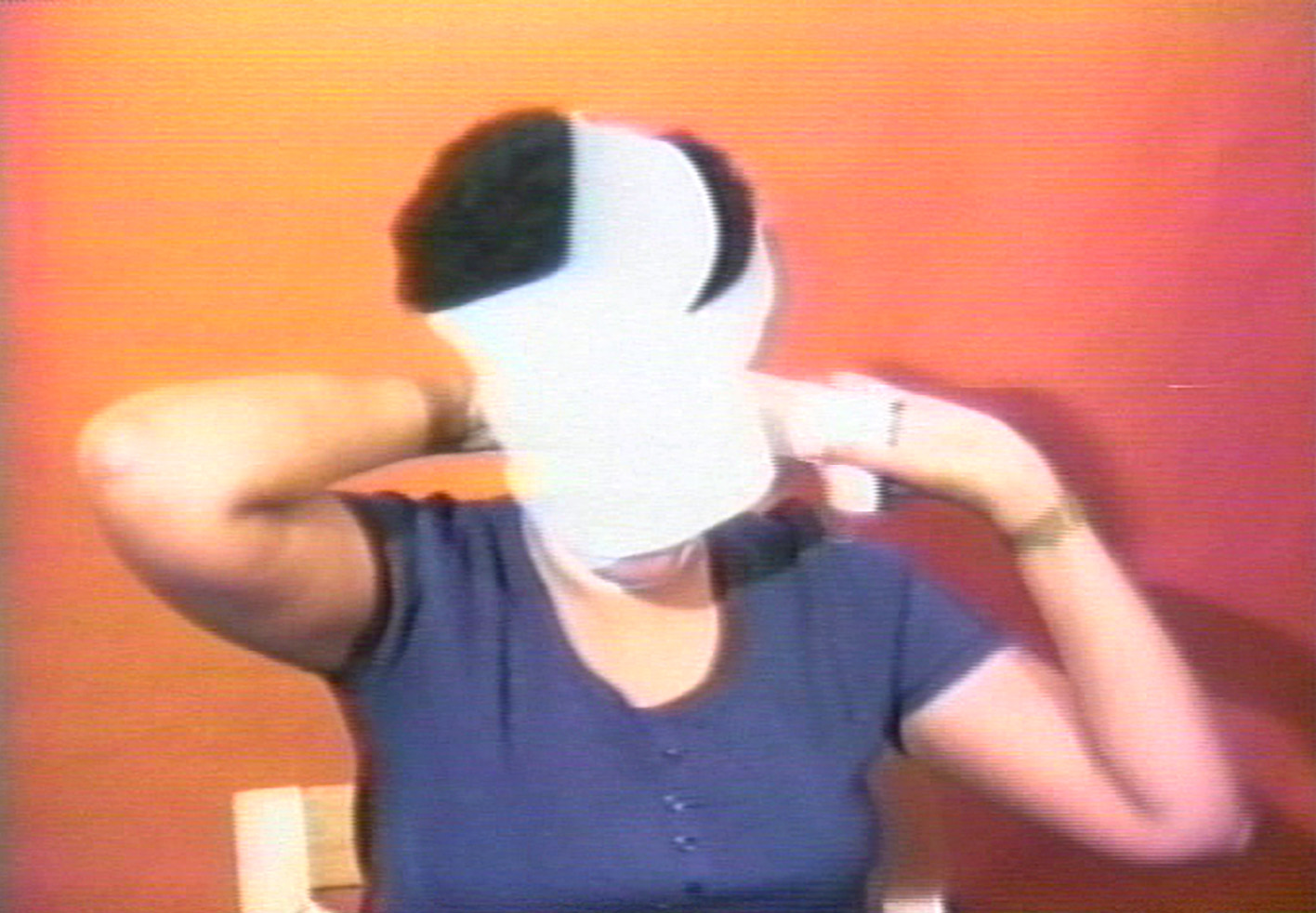 woman wrapping her head in a white bandage