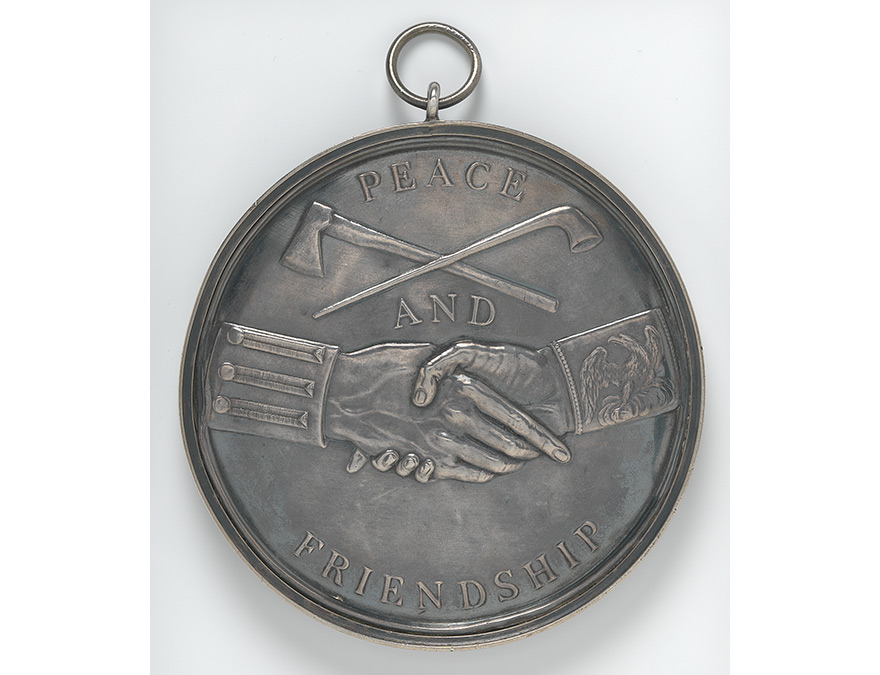 Medal depicting of shaking hands