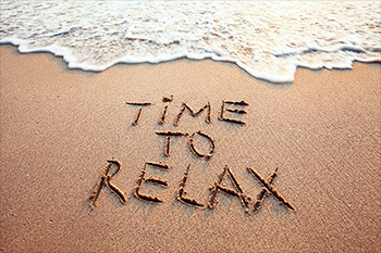 beach with "time to Relax" written in the sand