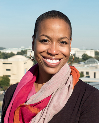 young African American woman with short hair wearing a colorful scarf