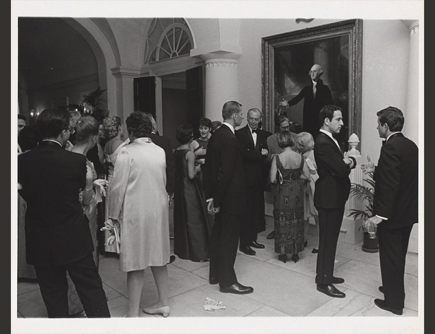 People milling around a portait in the gallery