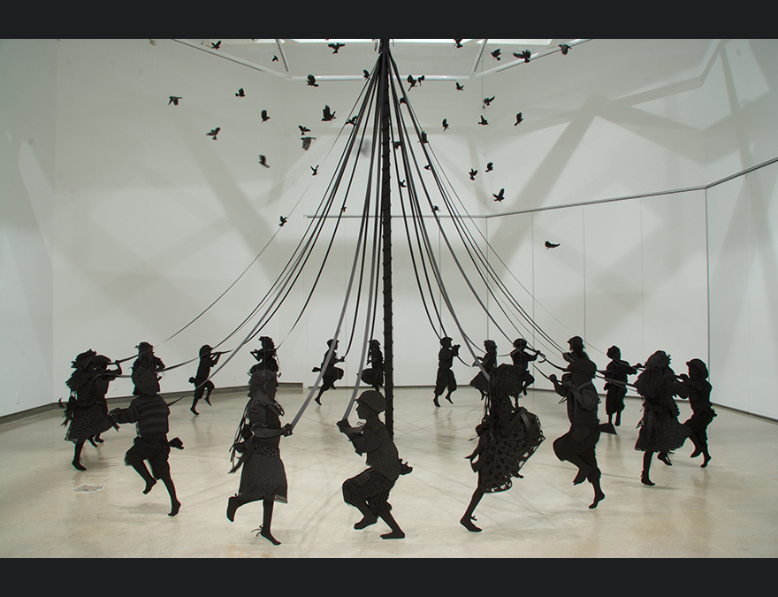 Black silhouettes of children dancing around a maypole with birds overhead