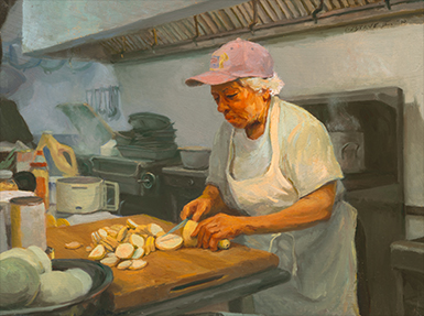 woman preparing food in a commercial kitchen