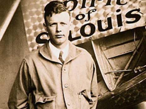 Charles Lindbergh next to his "Spirit of St. Louis" airplane