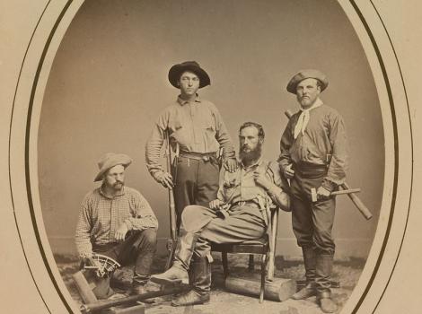 Sepia-toned photo of Clarence King and fellow explorers