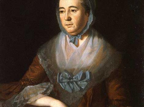 Oil on canvas painting of Anne Catharine Hoof Green, seated, in a formal dress holding a piece of paper
