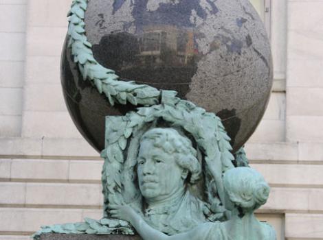 The Daguerre Monument -- a bust of Daguerre, topped by a large globe, and with a woman placing a wreath of leaves.  
