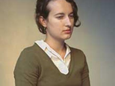 Photograph of yount woman looking sullen