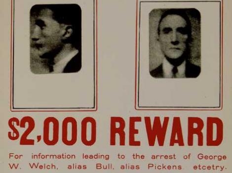 Poster with two mugshots reading "Wanted $2,000 Reward"
