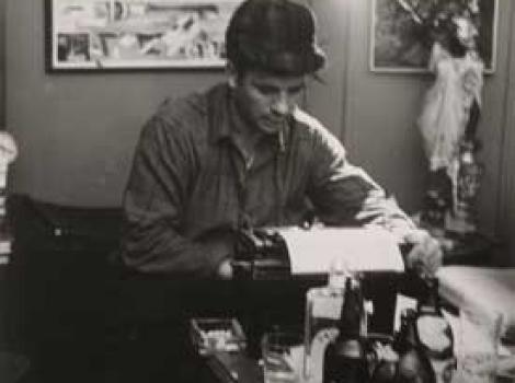 Black and white photo of Jack Kerouac at typewriter