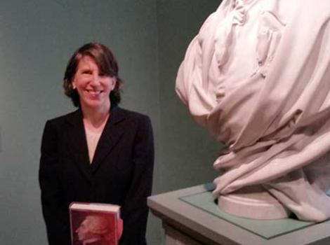 Author Laura Auricchio in the museum galleries, next to bust of Lafayette