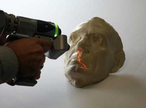 Lincoln life mask being 3d scanned with a handheld scanner