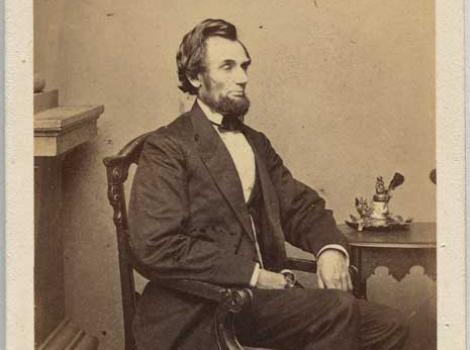 Photograph portrait of Lincoln sitting in chair