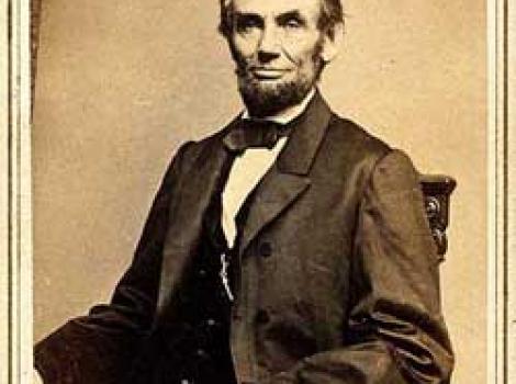 Photograph portrait of Lincoln, sitting in chair