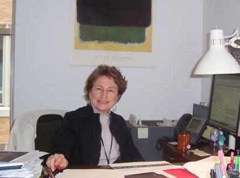 Linda Thrift, at her desk