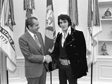 Black and white photo of Elvis and Richard Nixon shaking hands in the White House