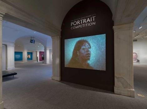 Exhibition entrnace, with projector art portrait