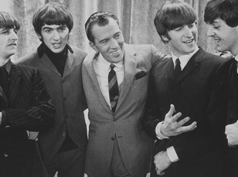 Black and white photo of Ed Sullivan and the Beetles