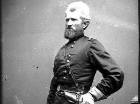 Black and white photograph portrait of Robert Milroy, standing and in uniform
