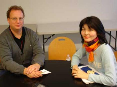 Warren Perry and Saki Tsuiki sitting at a table
