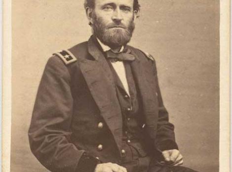 Black and white print of Ulysses S. Grant in military uniform, seated.