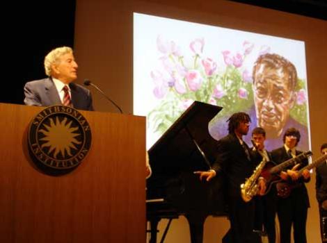 Tony Bennett at podium, speaking at the National Portrait Gallery