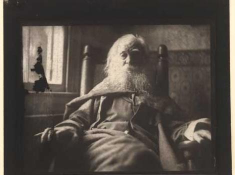 Black and white photo of bearded Walt Whitman