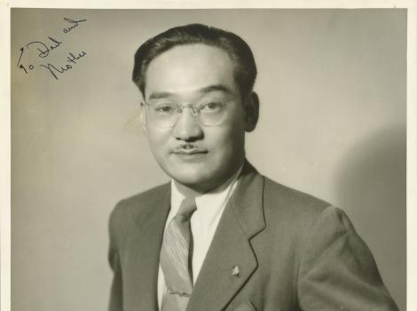 Black and white photo of man in three quarter view looking at the camera