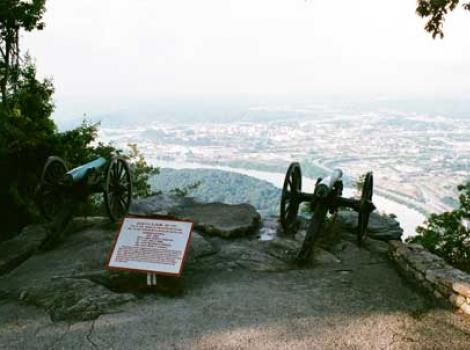 Daytime photograph from the top of Lookout Mountain with a Civil War-style cannon in the foreground