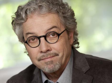 Color photo waist up of William Souder, wearing a suit and glasses.
