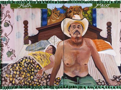 Bare-chested man in a cowboy hat sitting on a bed