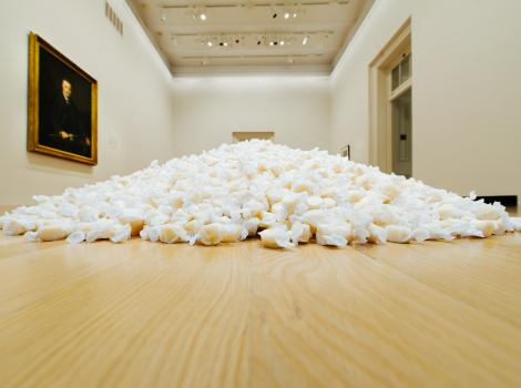 Small white packages on a hardwood floor.