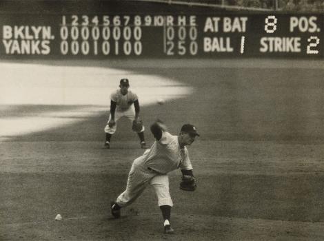 Baseball player throwing a pitch