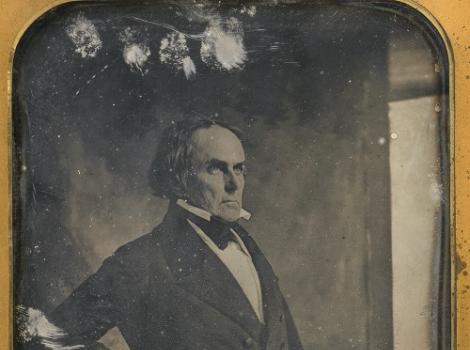 A daguerreotype of a balding man in profile wearing a suit