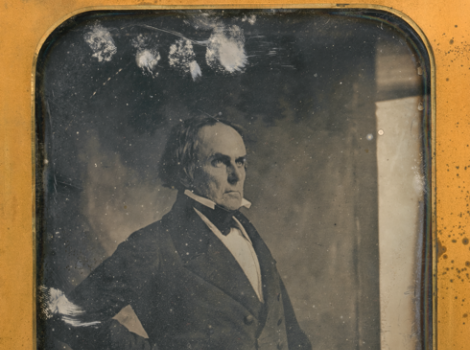 A daguerreotype of a balding man in profile wearing a suit