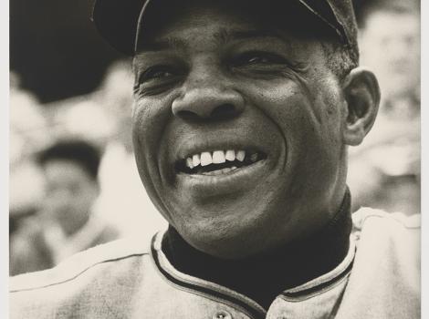 Photo of a smiling African American baseball player