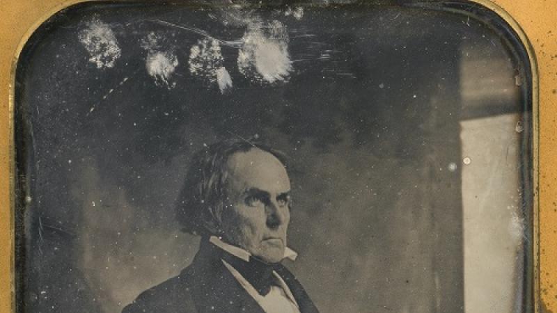 A daguerreotype of a balding man in profile wearing a suit