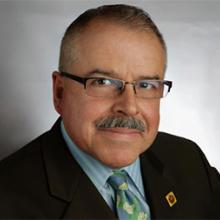 mustached man with glasses