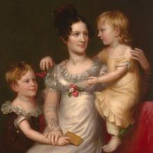 A painting of an 18th-Century woman sitting on a couch with her two young children.