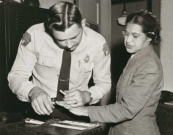 Black and white photo of Rosa Park's, being booked in jail