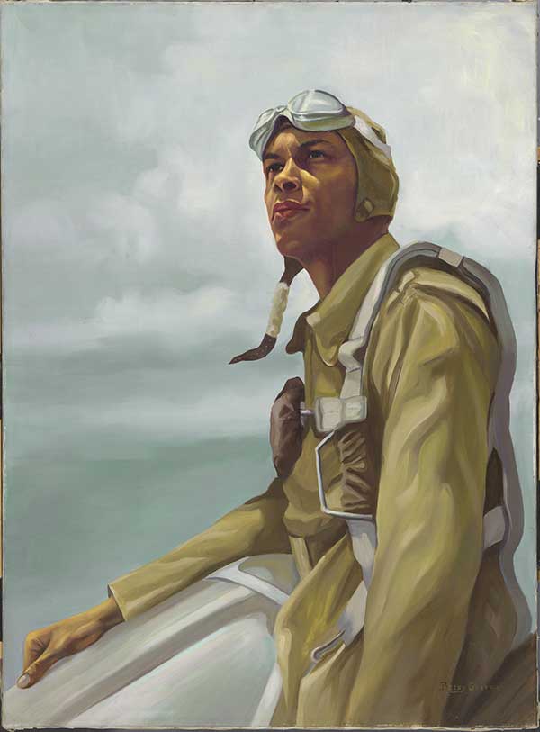 William Ayers Campbell in pilot gear, with flight goggles resting on cap on head. He is pictured against a hazy, cloudy sky.